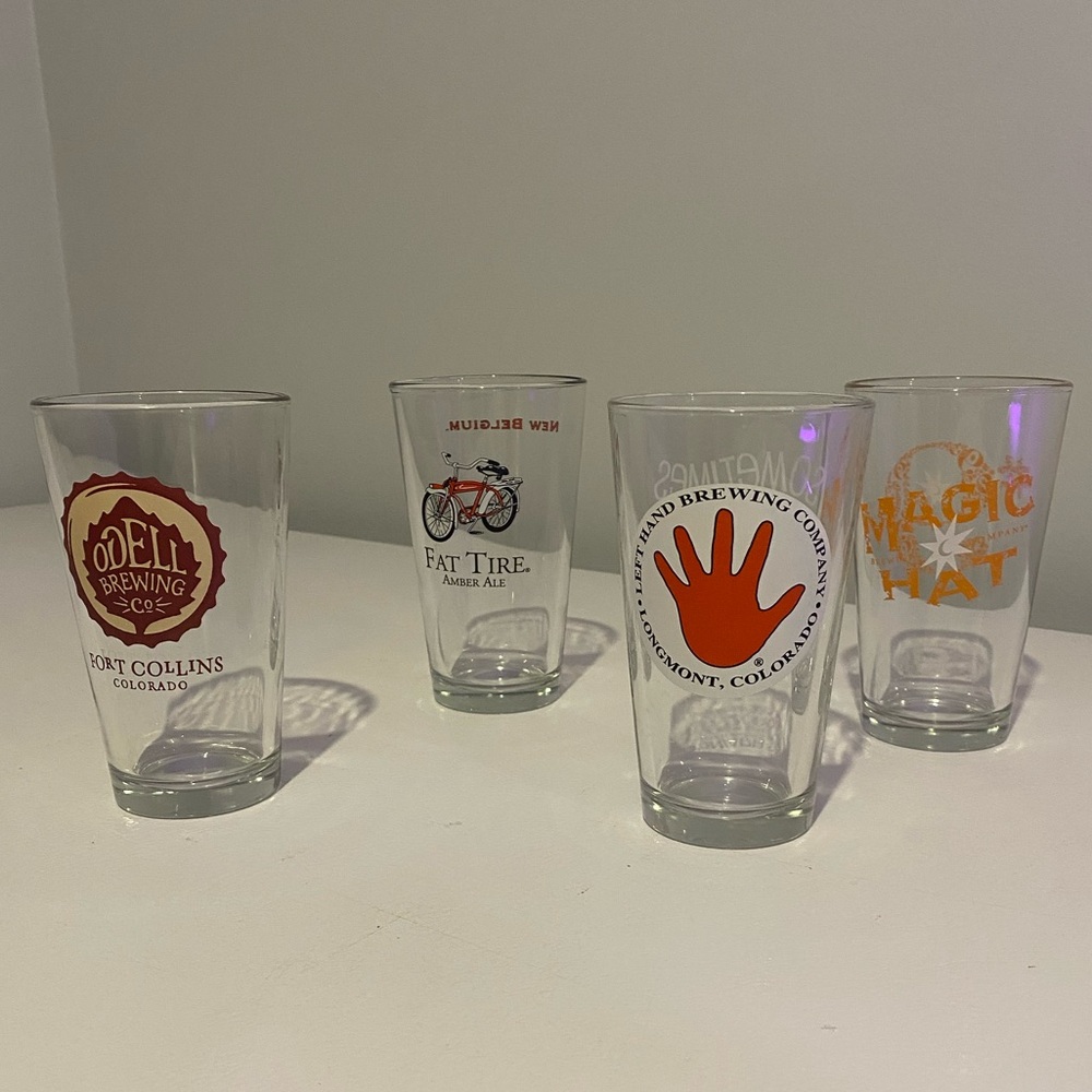 Four Brewery Pint Glasses. Excellent condition.